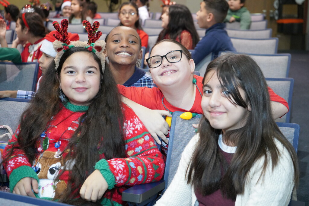 elementary students in the auditorium seats about to view holiday play
